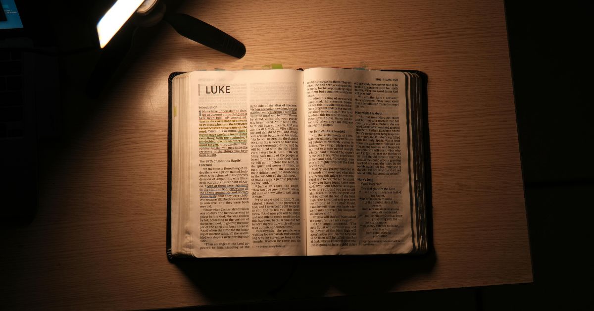 A mother's faith depicted in this image of an open bible being read by lamp light. Even when the night is dark, a mother keeps praying for her children.